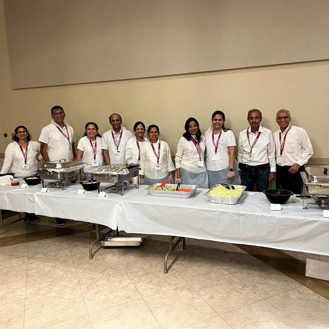 Volunteers serving food indoors